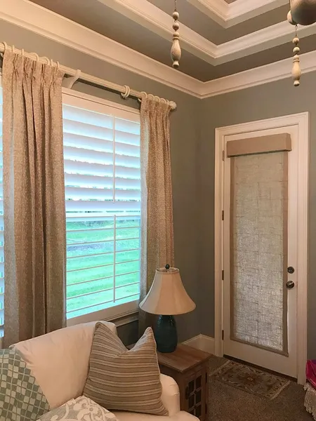 Drapery panel detail beside a window