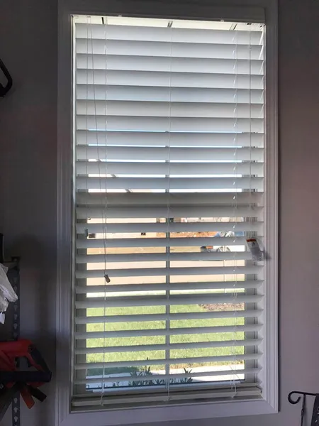 Wood blind detail at a narrow window
